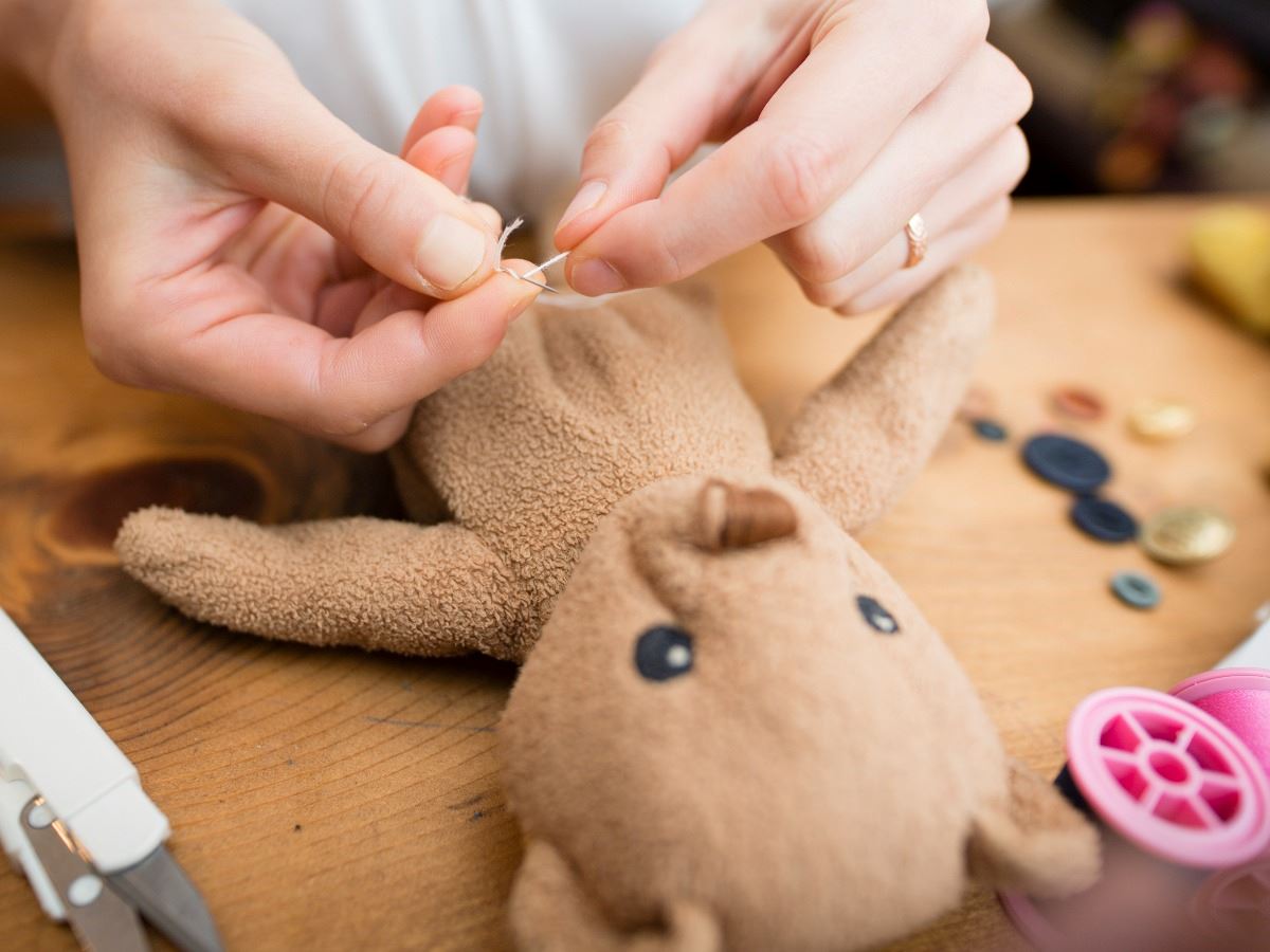 Teddy bear getting mended