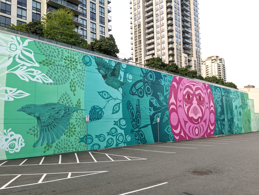 Image of The Ripple, a mural with a Coast Salish spindle whorl face at its centre