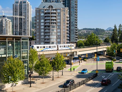 A SkyTrain goes by on Pinetree Way in Coquitlam.