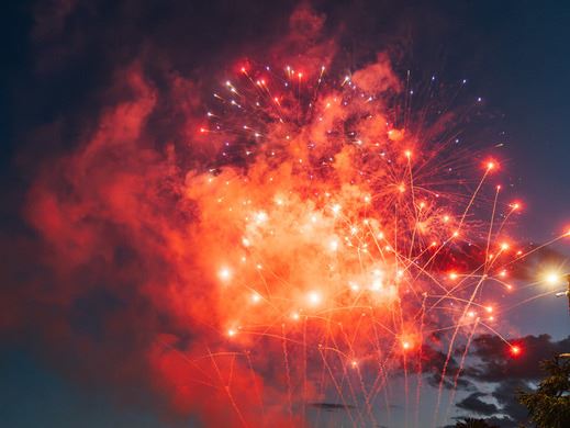 Red fireworks display over Lafarge Lake