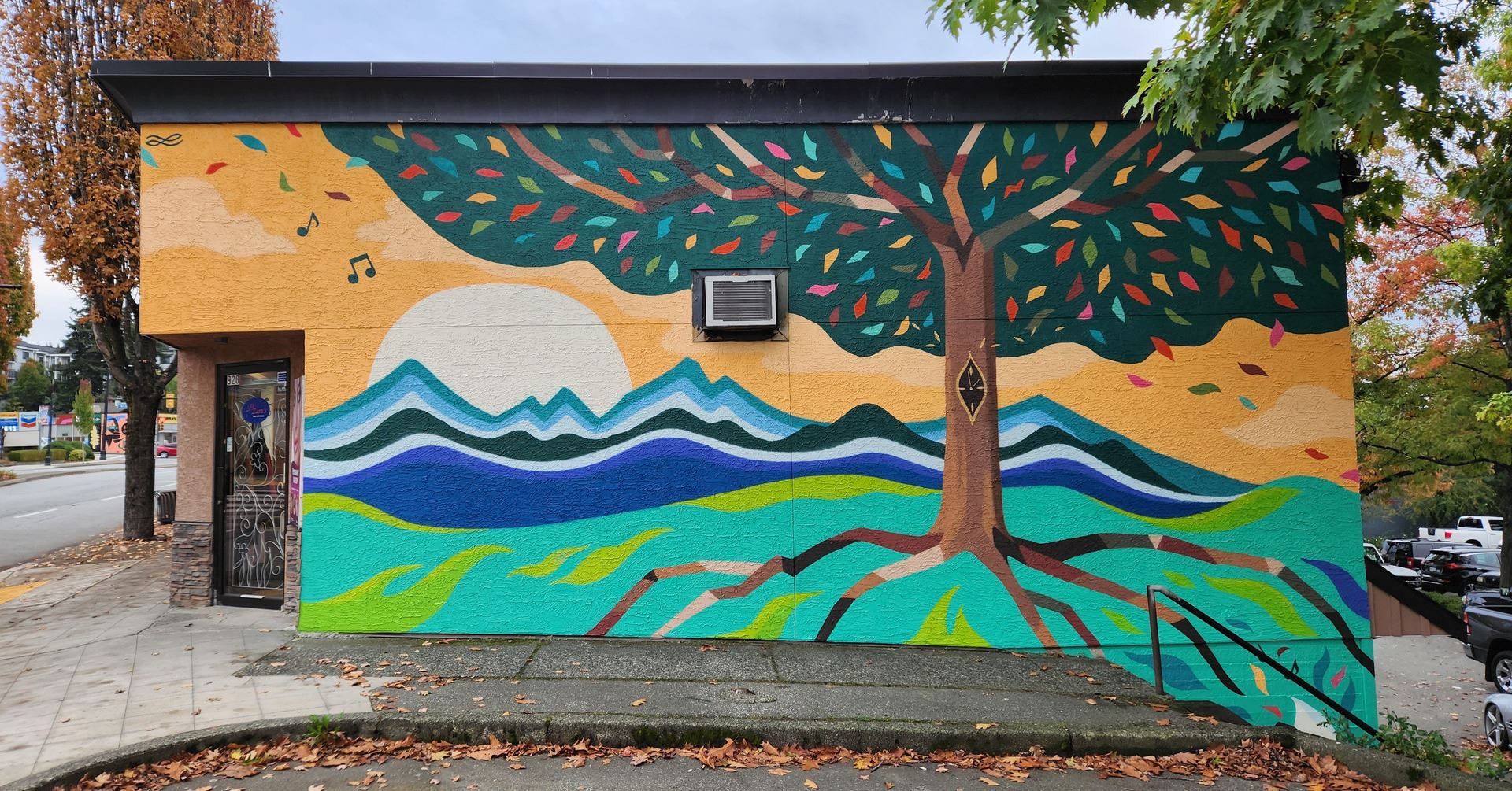 Image of a tree mural painted on side of building