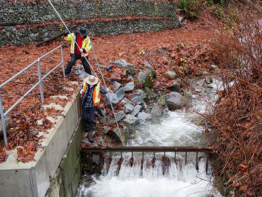 Image of public works crew working during atmospheric river weather event.