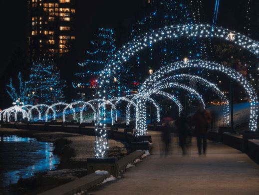 People walking around the light display
