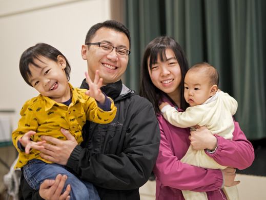 Family of four smiling