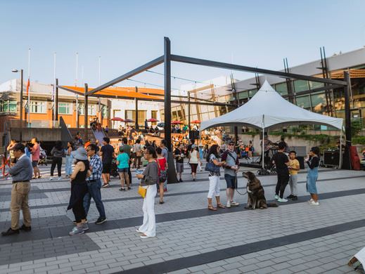 A crowd of people in Buchanan Square in Coquitlam.