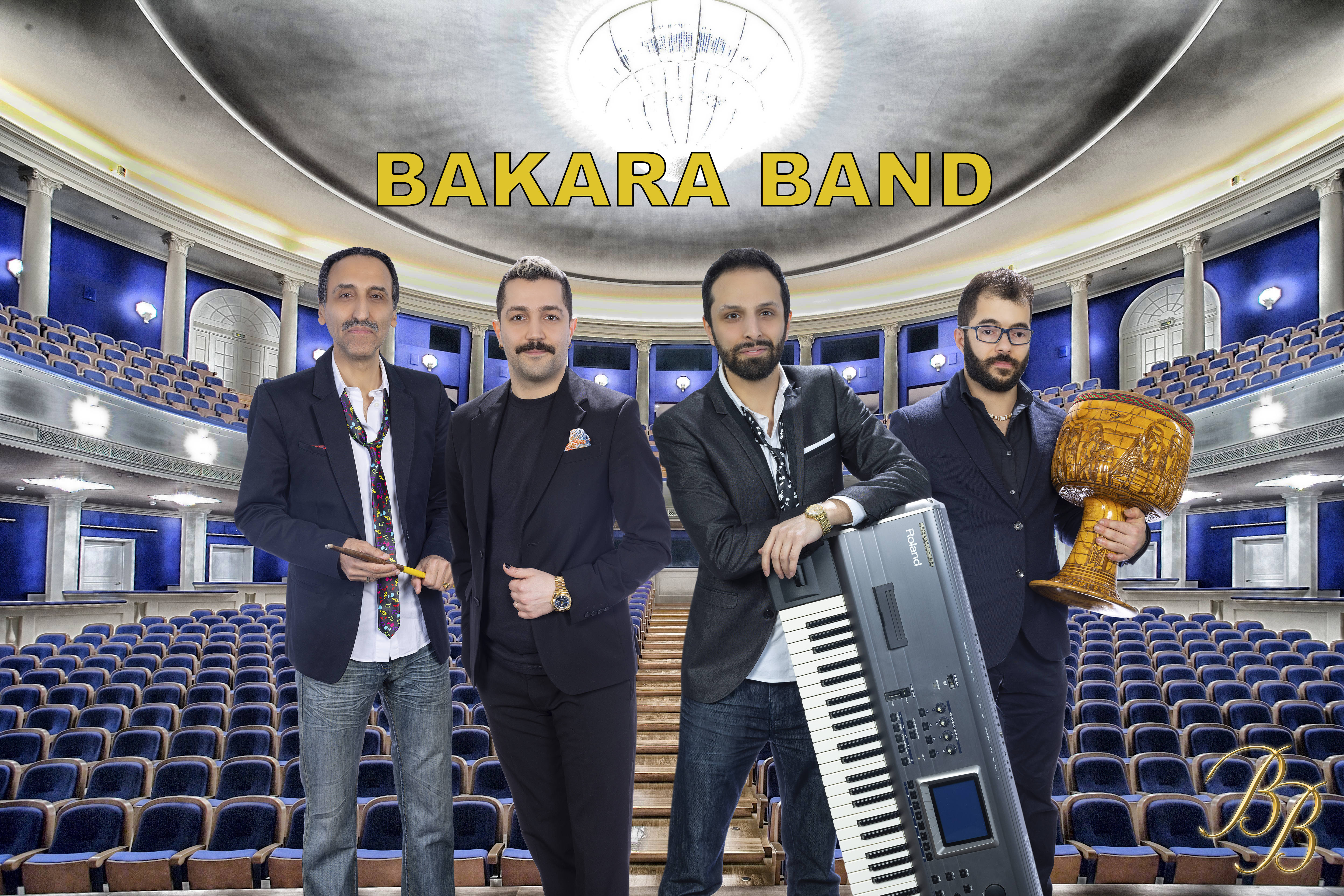 Four members of the Bakara Band standing in a concert hall while holding instruments.