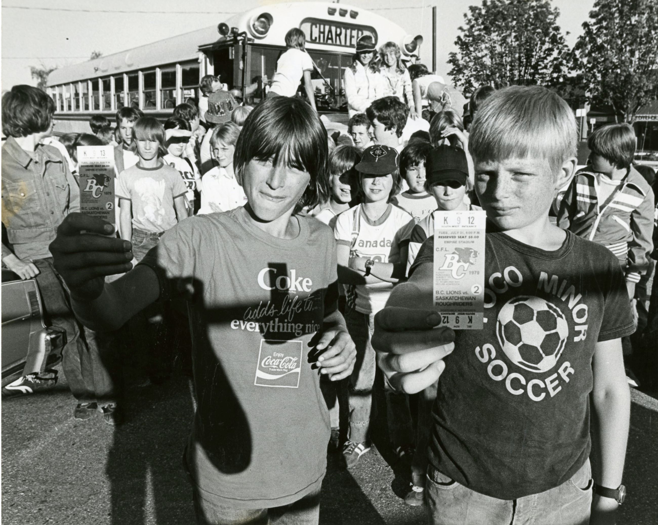 Enterprise news carriers (Harald Siegemund, Kevin Ridley) going to a BC Lions game, 1979