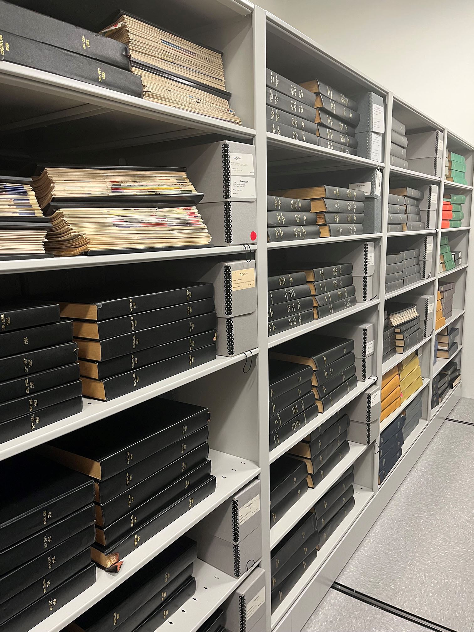 Bound newspapers at the City of Coquitlam Archives, 2025