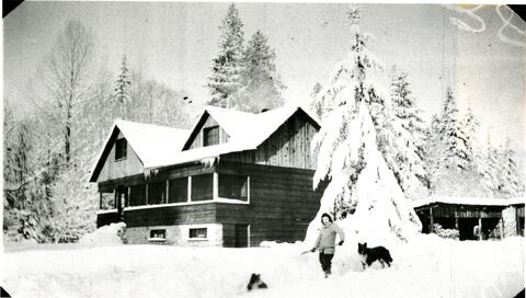 Clara Jacobs shoveling snow at Steelhead Lodge (Oxbow Ranch), n.d.