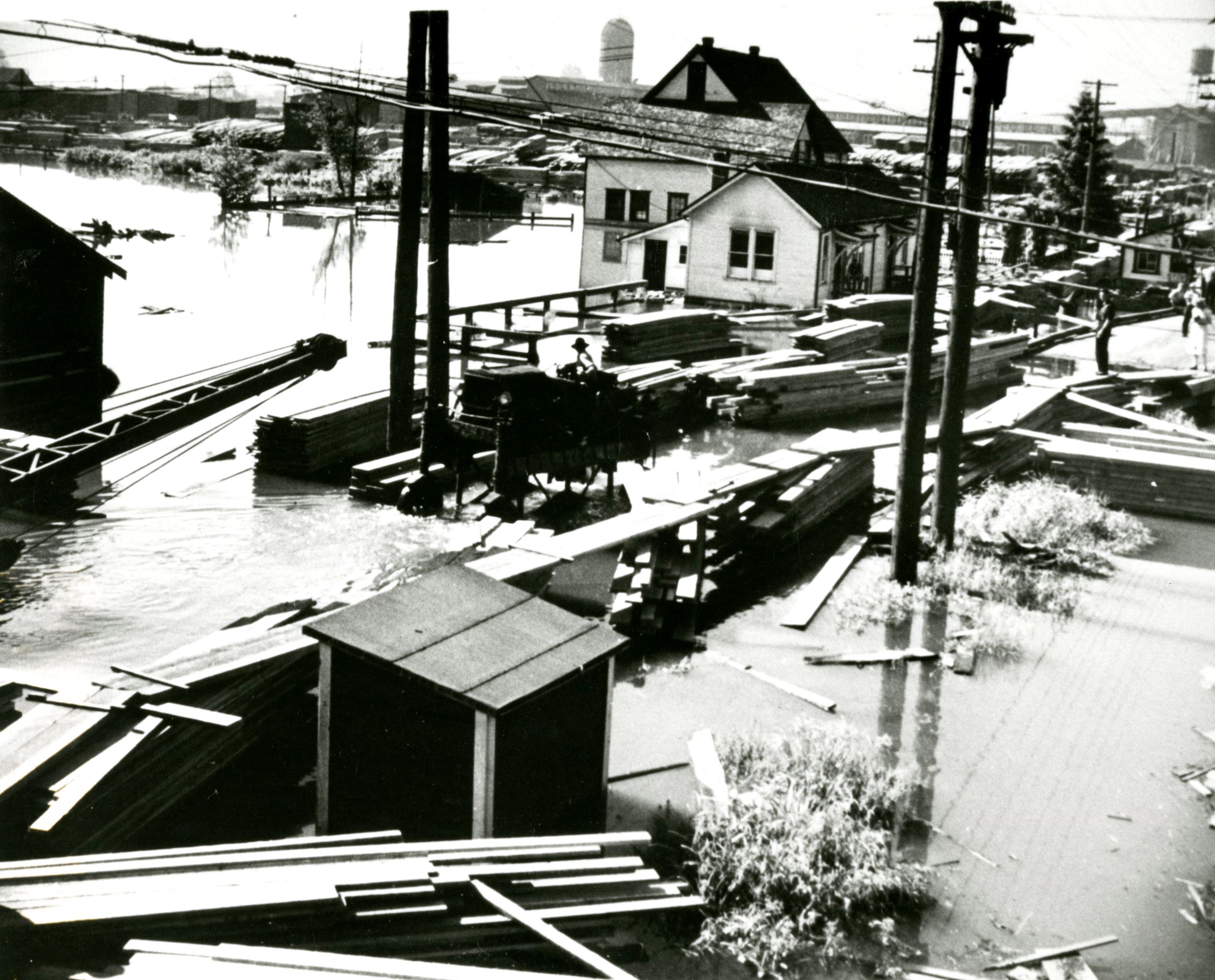 Wooden walkways constructed to deal with flooding at Fraser Mills, 1948 (Source City of Coquitlam Ar Opens in new window