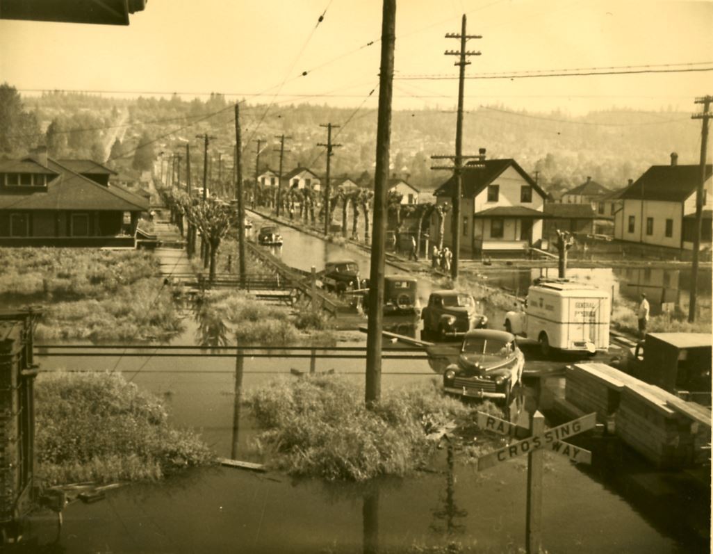 Fraser Mills Townsite and railway crossing during flood, 1948 (Source City of Coquitlam Archives, C1 Opens in new window