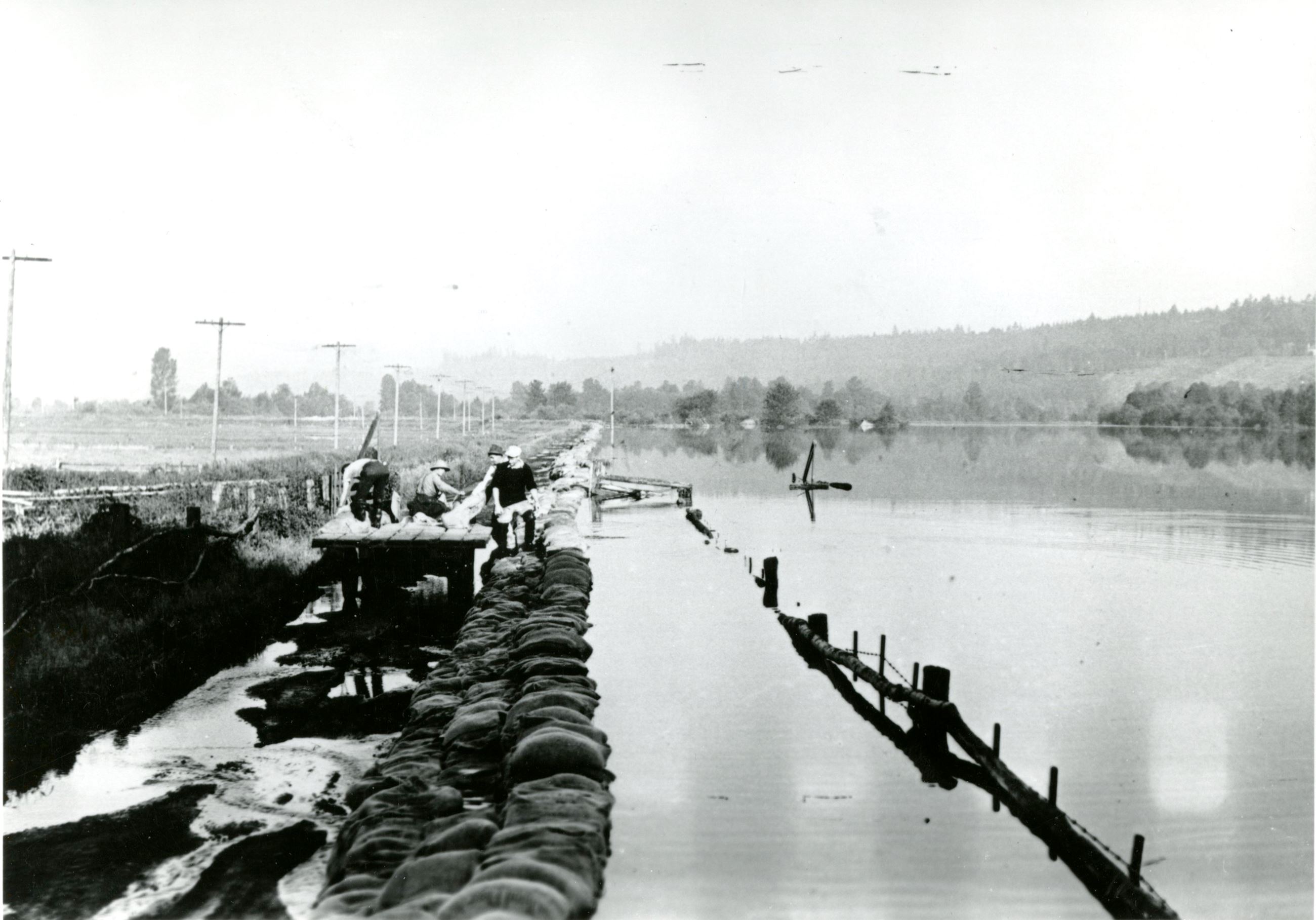 Maintaining the dykes during Flood at Colony Farm (Source City of Coquitlam Archives, C6.1087) Opens in new window